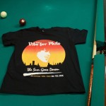 Vibe for Philo printed t-shirt resting on a pool table with a cue and seven ball